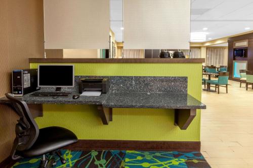 an office with a desk with a computer on it at La Quinta by Wyndham Midland North in Midland