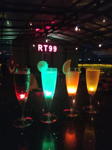 a group of four wine glasses sitting on a table at Hotel Broadway Yangon in Yangon