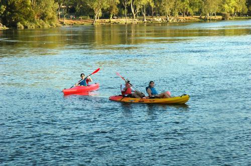 a group of people in kayaks on a river at Hotel Vila da Guarda in A Guarda