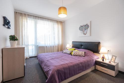 Postel nebo postele na pokoji v ubytování NC Apartment Ruse