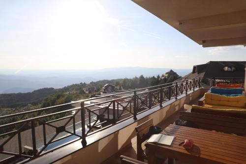 a balcony with a view of the mountains at Premier 24 Milmari Kopaonik in Kopaonik