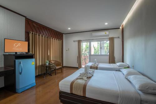 Photo de la galerie de l'établissement Pimann Inn Hotel, à Chiang Rai