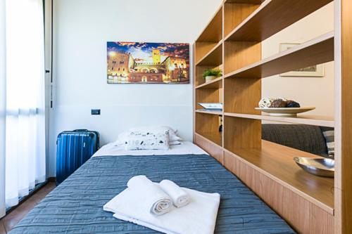 Ένα ή περισσότερα κρεβάτια σε δωμάτιο στο Casa Temporanea