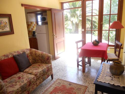 a living room with a couch and a table at Casa Rural Anton Piche with Pool-Adults Only in Granadilla de Abona