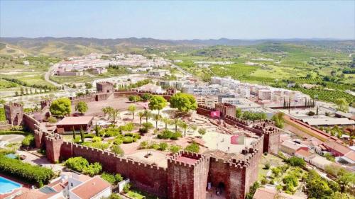 an aerial view of a city with a castle at Luxury Apartment Silves - Algarve in Silves