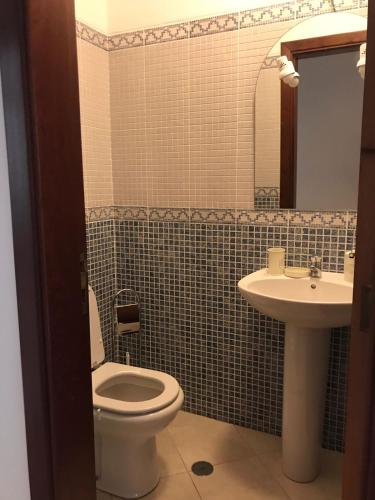 a bathroom with a toilet and a sink at Luxury Apartment Silves - Algarve in Silves
