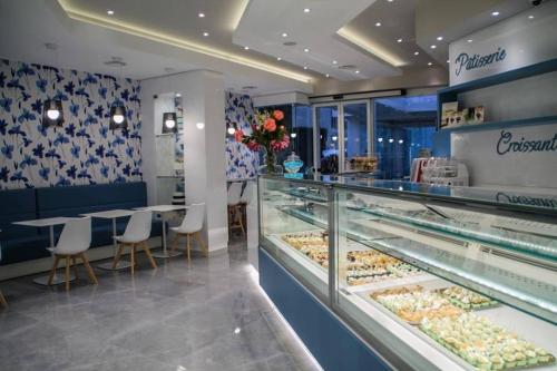 a bakery with a display case filled with pastries at B&B Lo Scrigno del Salento in Sava