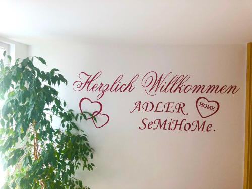 a wall with a sign that reads individual willinson older sister summon me at SeMiHoMe in Dietingen