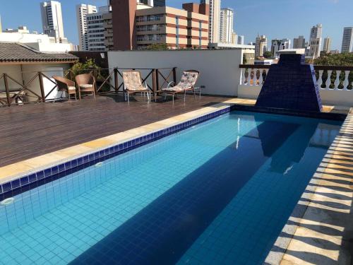 a swimming pool on the roof of a building at Angra Praia Hotel in Fortaleza