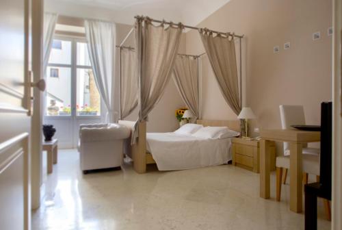 Ένα ή περισσότερα κρεβάτια σε δωμάτιο στο Palazzo Brunaccini Boutique Hotel