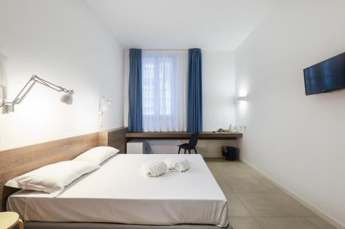 Кровать или кровати в номере bellaMI