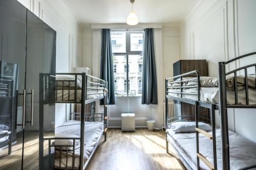 Postel nebo postele na pokoji v ubytování Sandeman-Allen Hostel (Bayswater)
