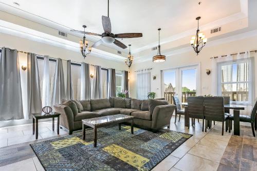 a living room with a couch and a table at Spacious 4BR Condo on Carondelet Near All Hot Spo in New Orleans