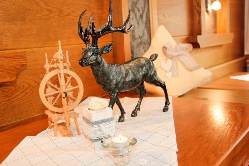 a figurine of a deer on a table at Gästeheim Anna in Längenfeld