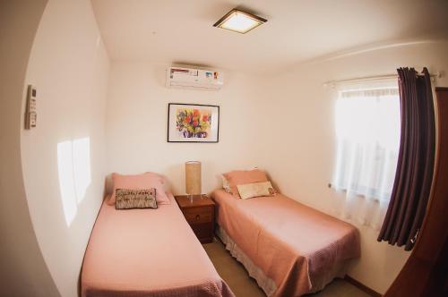 Säng eller sängar i ett rum på Cumbuco Dream Village