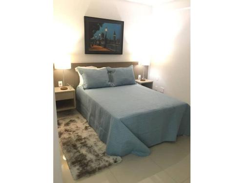 Ένα ή περισσότερα κρεβάτια σε δωμάτιο στο Flat inteiro Ônix Bueno