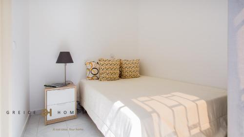 Postel nebo postele na pokoji v ubytování GREICE HOMES 1 BEDROOM APARTMENT CENTRE OF VILAMOURA