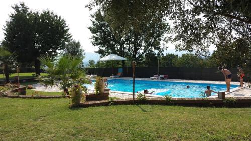 a group of people in a swimming pool at VILLA "Casa al Chiazzullo" in Mirabella Eclano