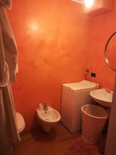a bathroom with a toilet and a sink at La Casetta in Como
