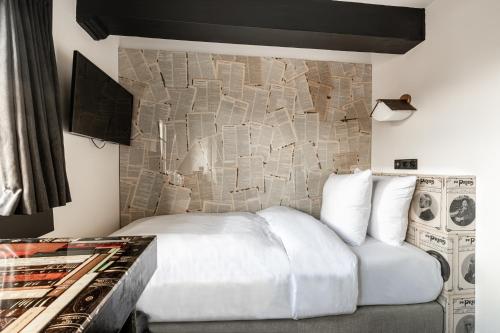 Un ou plusieurs lits dans un hébergement de l'établissement Boutique Hotel The Craftsmen