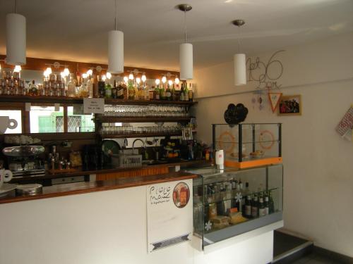 a bar with a lot of bottles of alcohol at al 106 in Trieste