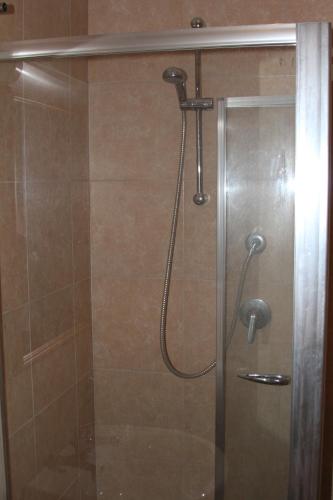 a shower with a shower head in a bathroom at Agriturismo Silos Agri in San Severo