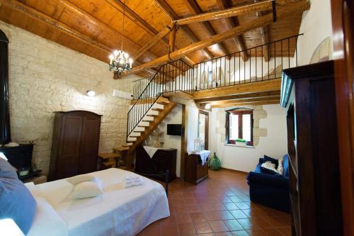 Ένα ή περισσότερα κρεβάτια σε δωμάτιο στο Donna Tommasa