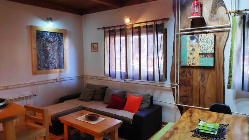 a living room with a couch and a table at Apartments Life in Kolašin