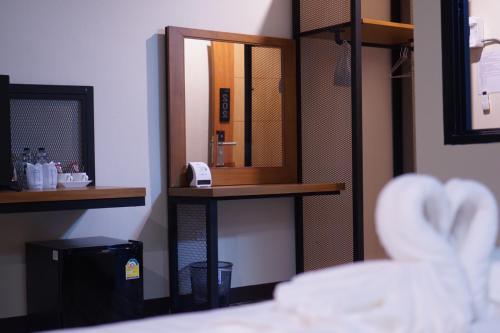 Postel nebo postele na pokoji v ubytování S.S.Hotel Nangrong