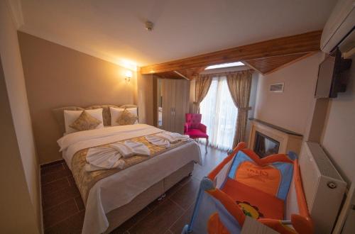 Postel nebo postele na pokoji v ubytování Ağva Carpediem Otel