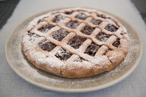 a pie sitting on a plate on a table at B&B Nonna Rosa in Norcia