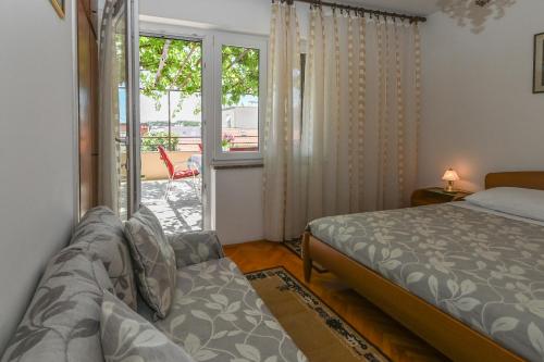 Postel nebo postele na pokoji v ubytování Apartment Lara