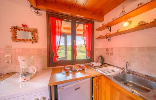 a kitchen with a sink and a window at Snow Captain in Arachova