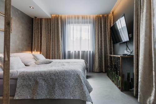 Tempat tidur dalam kamar di VILLA BRICOLA - Boutique Apartments