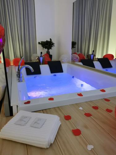 a white table with red hearts on the floor at Le Dimore Degli Archi Catania in Catania