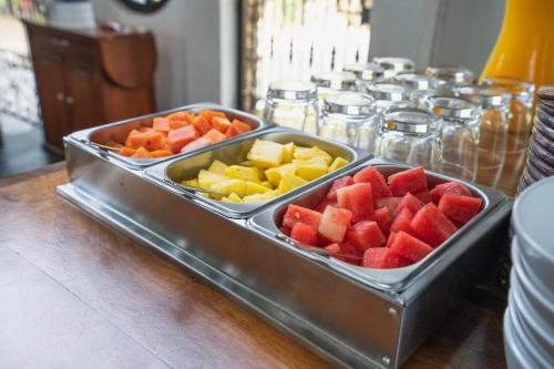 two trays of fruit on top of a table at Casa de Olas Boutique Hotel in Puerto Escondido