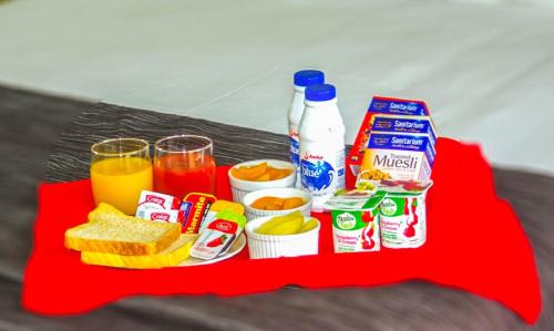 a tray of food and drinks on a red table at Bella Vista Taupo in Taupo
