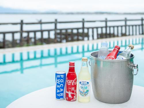a bucket full of soda and bottles on a table at Iwamotoro in Fujisawa