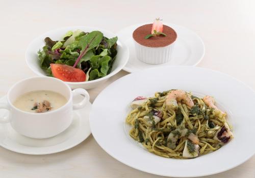 a table with three plates of food and a cup of coffee at LEGOLAND Japan Hotel in Nagoya