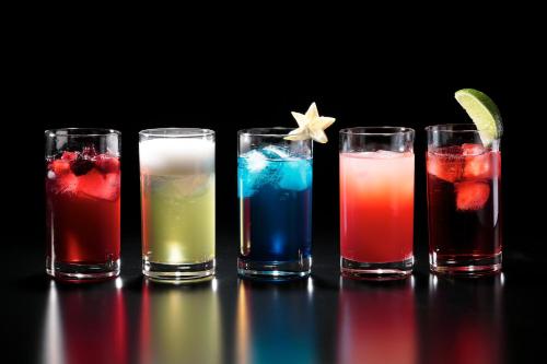 four glasses of different colored drinks on a table at LEGOLAND Japan Hotel in Nagoya