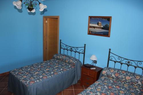 Säng eller sängar i ett rum på Casa Rural La Florentina