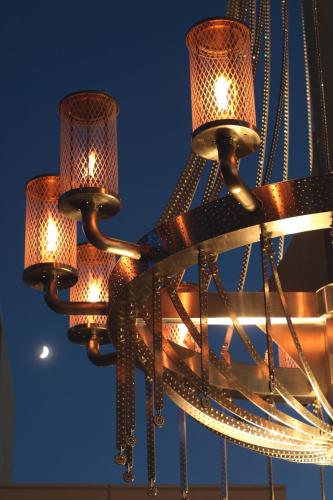 a chandelier with six lights hanging from it at Hotel Arc Riche Toyohashi in Toyohashi