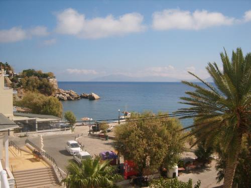 a view of the ocean from a building at Apostolakis Rooms in Agios Kirykos