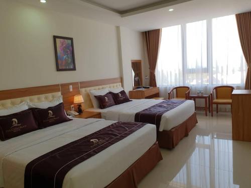 Katil atau katil-katil dalam bilik di Phu Cuong Beach Hotel
