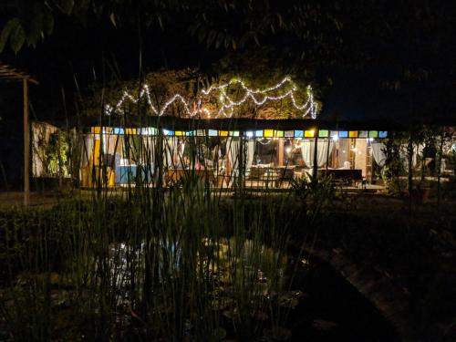 a building with lights on it at night at Bohemyan Blue Stay in Alibaug