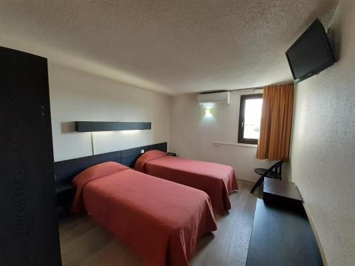 Krevet ili kreveti u jedinici u okviru objekta Hotel les Tourrades
