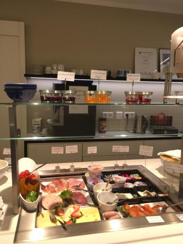 a buffet line with many different types of food at Sebcity Hotel in Ellwangen