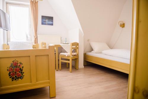 Ein Bett oder Betten in einem Zimmer der Unterkunft Allmanns-Kroog