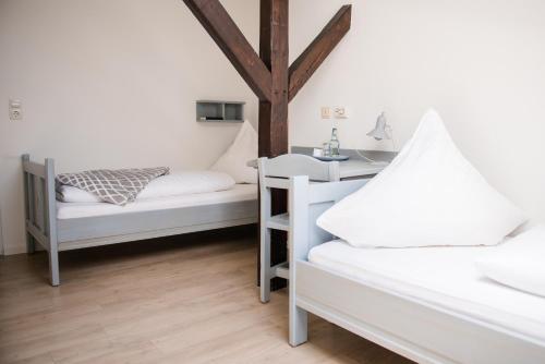 Ein Bett oder Betten in einem Zimmer der Unterkunft Allmanns-Kroog