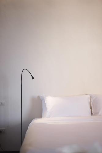 Ένα ή περισσότερα κρεβάτια σε δωμάτιο στο Wonderwall Hotel